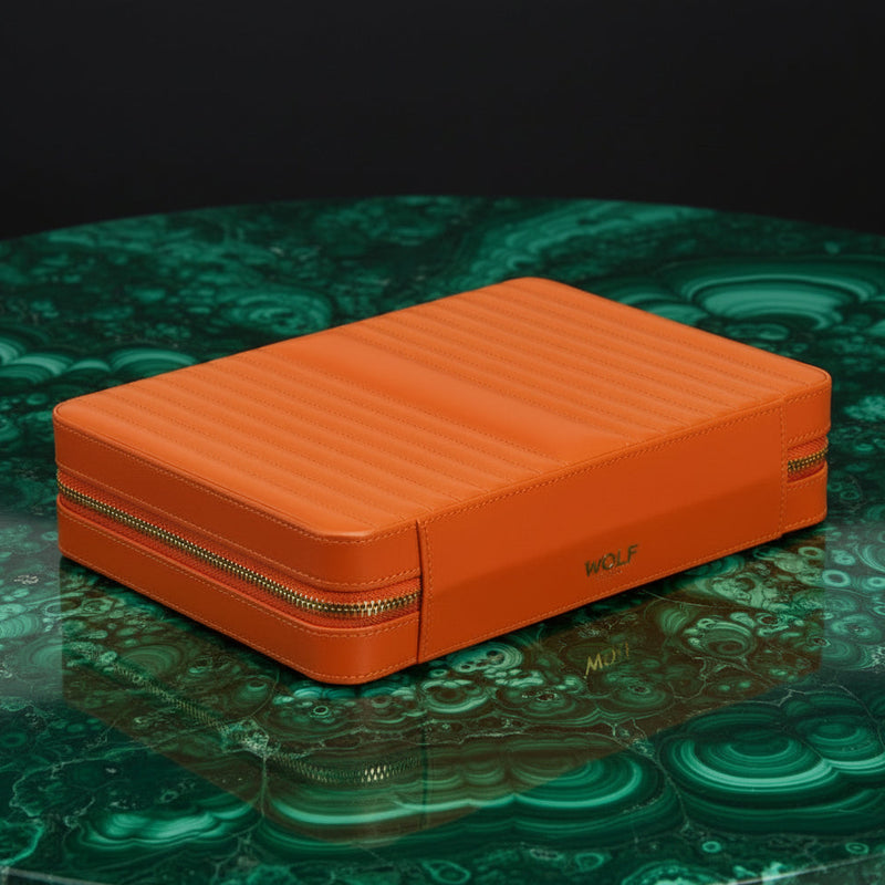Orange jewelry box with 'WOLF' branding on a white background