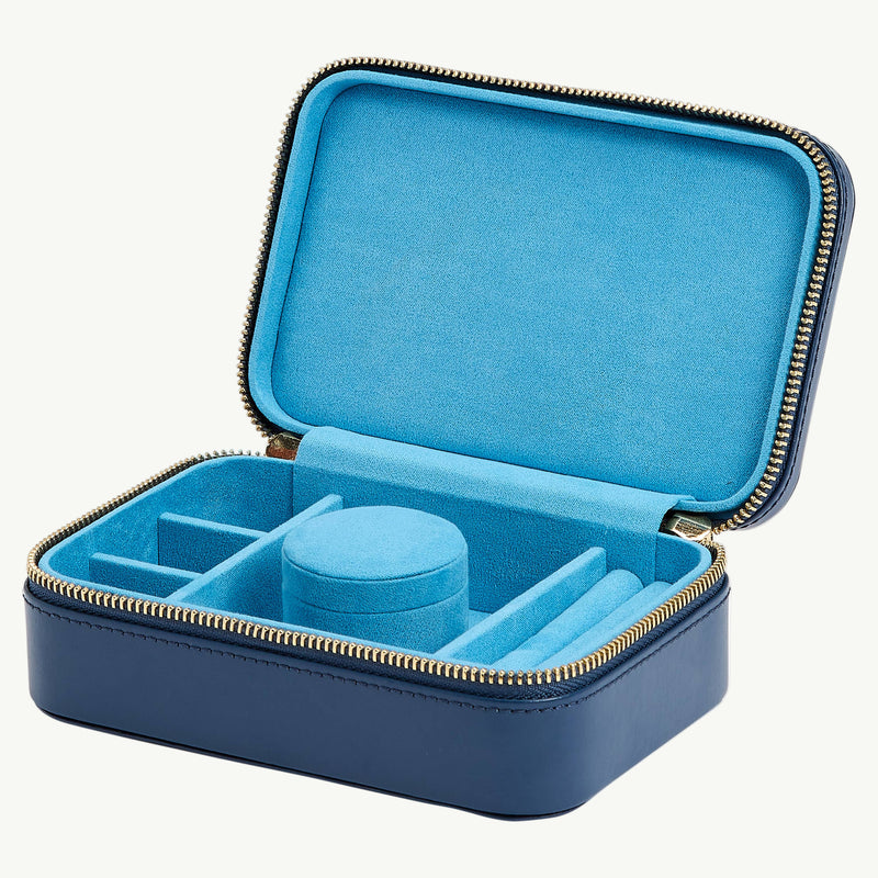 Blue jewelry case with compartments on a white background