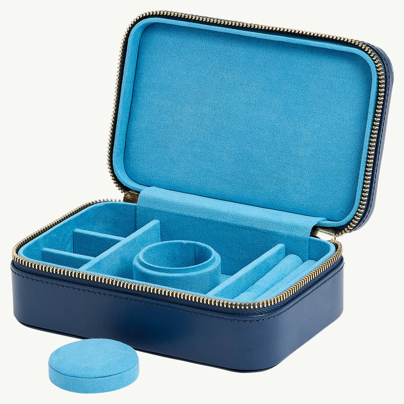 Blue jewelry case with compartments on a white background